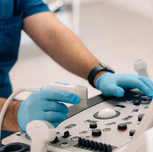 surgeon working an ultrasound machine