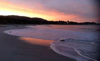 Sunrise over Carmel by the Sea beach.