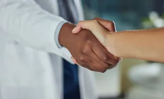 Doctor shaking hands.
