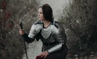 Woman in armor wielding sword