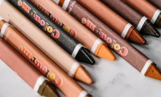 Crayons depict various skin tones.