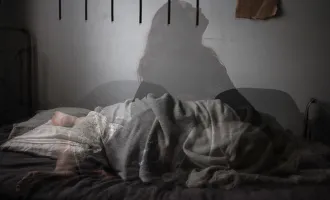 Shadow of a woman on bed