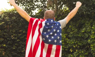 Man wearing flag cape
