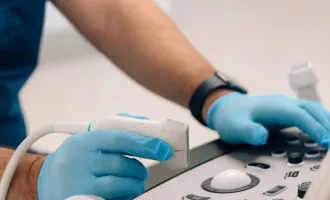 surgeon working an ultrasound machine