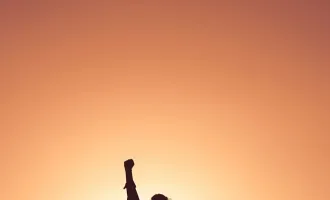 Woman raising fist.