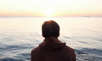 Man looking out to sea.
