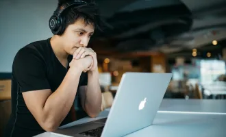 Student sitting in front of laptop