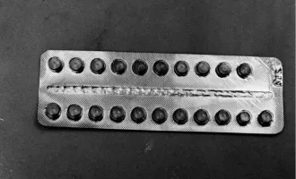 A photo of a packet of birth control pills circa 1960s.
