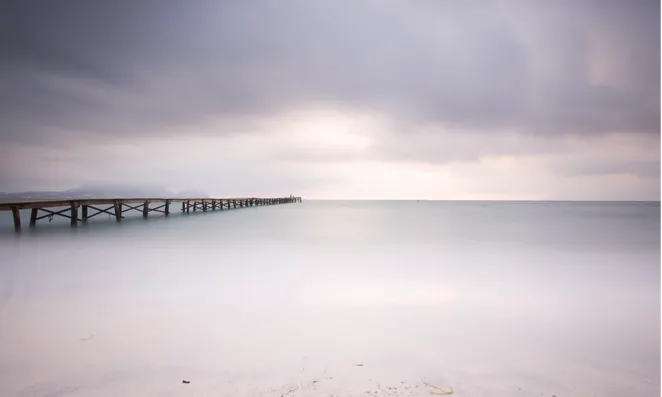 Pier under overcast sky.