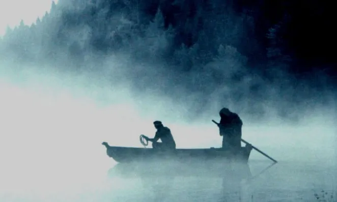 Ferryman with passenger.