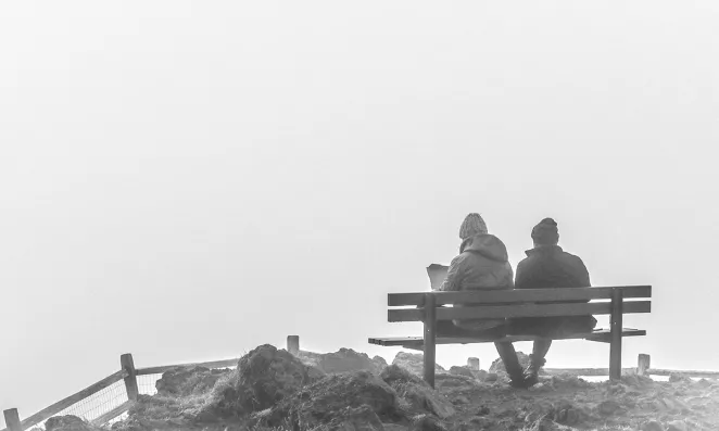 Couple on a park bench.