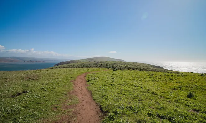 Path on green hillside.