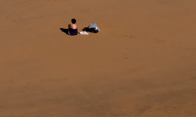 Woman sitting on beach