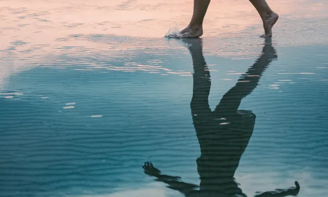 Woman walking on beach