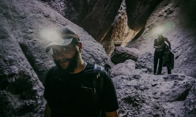 Headlamps light up dust particles at Pinnacles National Park. 