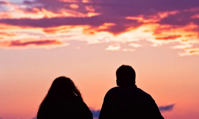 Couple sitting together.