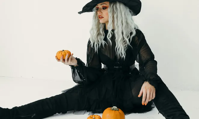 Woman in witch costume.