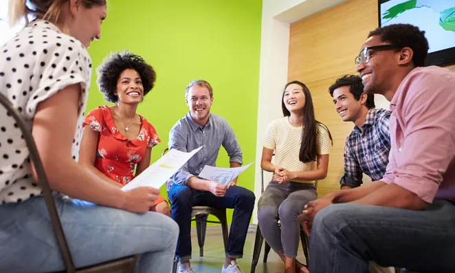 Image of group of students sitting in circle.