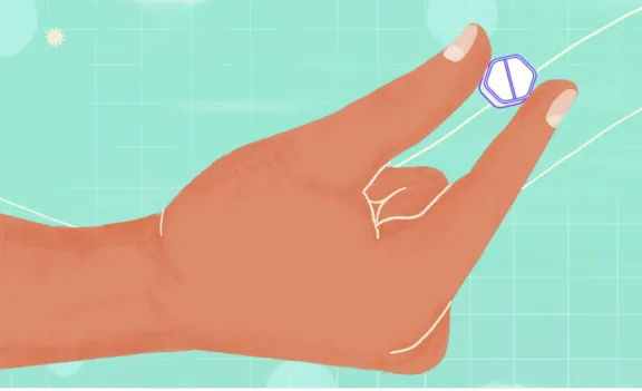Illustration of hand holding pill.