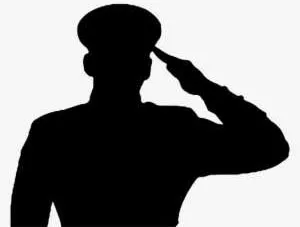 Saluting soldier in silhouette.