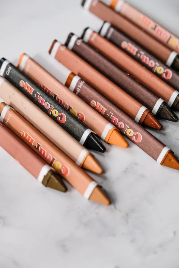 Crayons depict various skin tones.