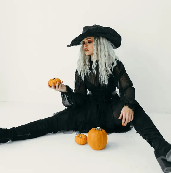 Woman in witch costume.